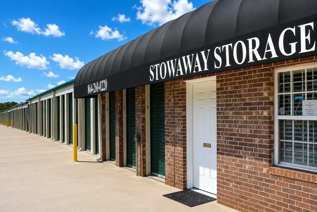 Stowaway Storage facility exterior with green roll-up doors